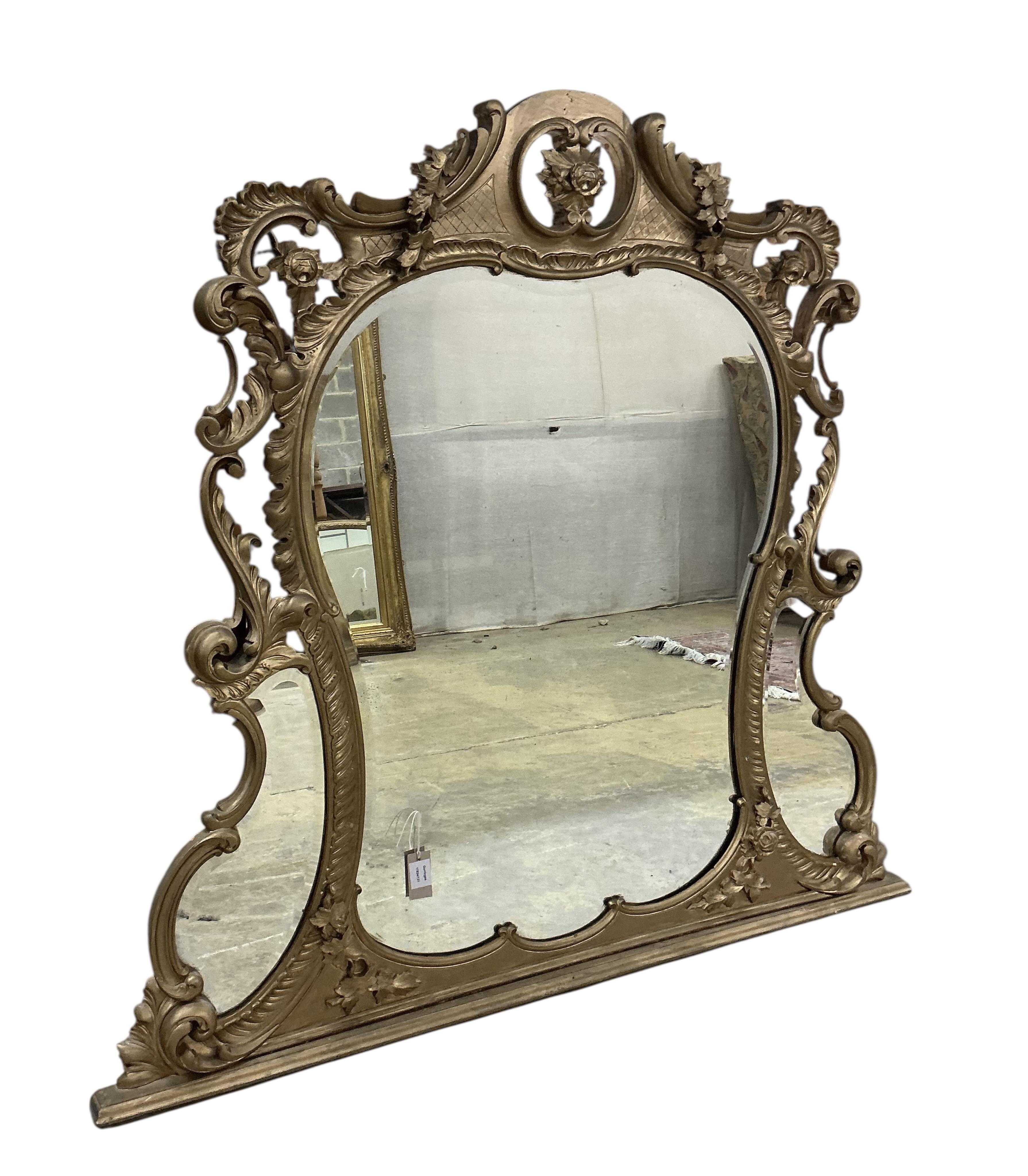 A Victorian giltwood and composition overmantel mirror with bevelled plates, later gilt painted, width 142cm, height 130cm
